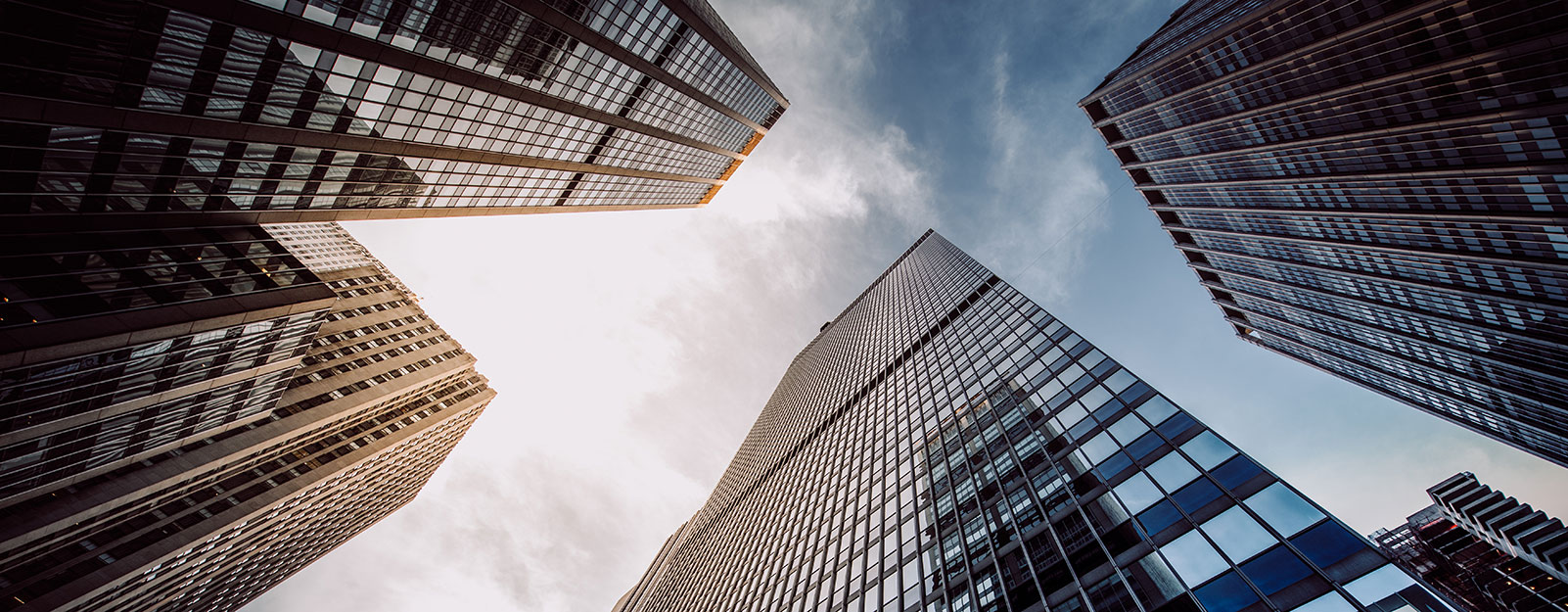 Looking up at skyscrapers